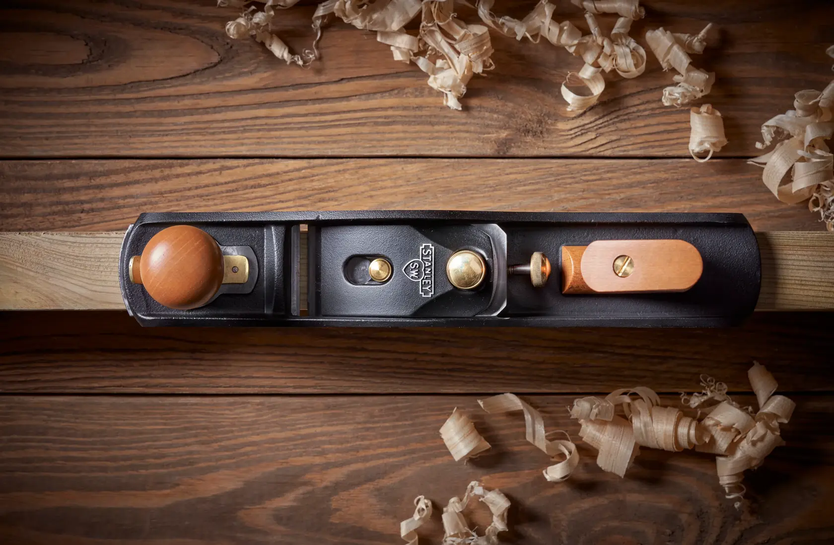 STANLEY 1-12-137 hand plane top view on wood surface with wood shavings, photography product.