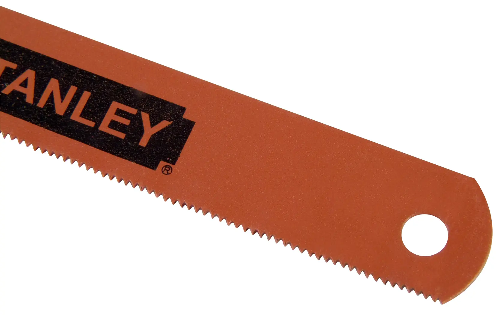 Close-up of a Stanley red saw blade with small teeth and a hole for hanging at the end.