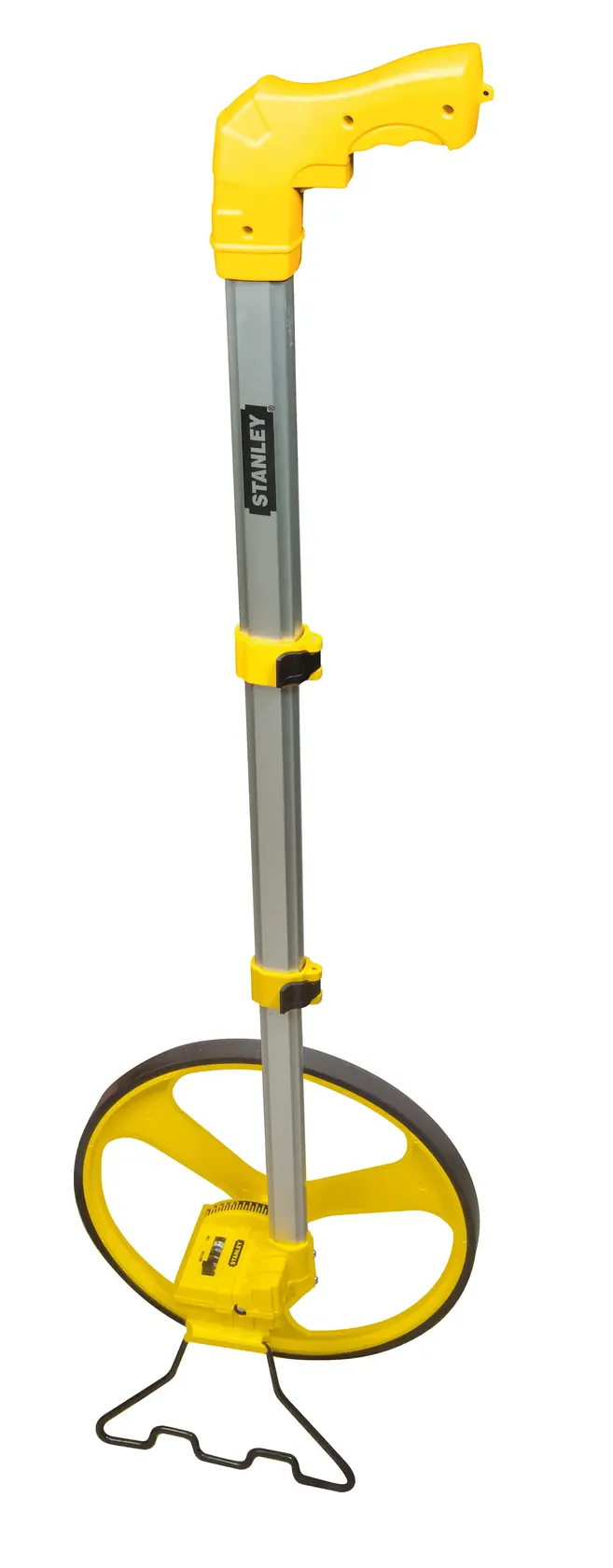 Photo of STANLEY 1-77-174 yellow measuring wheel with handle, side angle, white background.