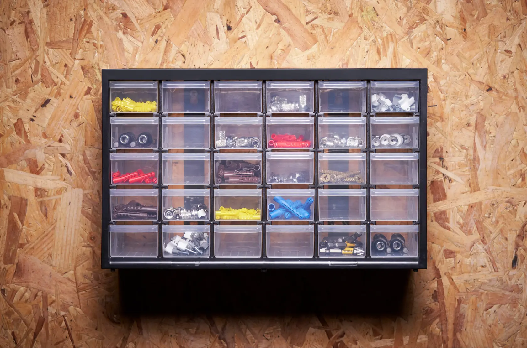 STANLEY 1-93-980 organizer cabinet with clear drawers holding assorted hardware, photographed front-on.