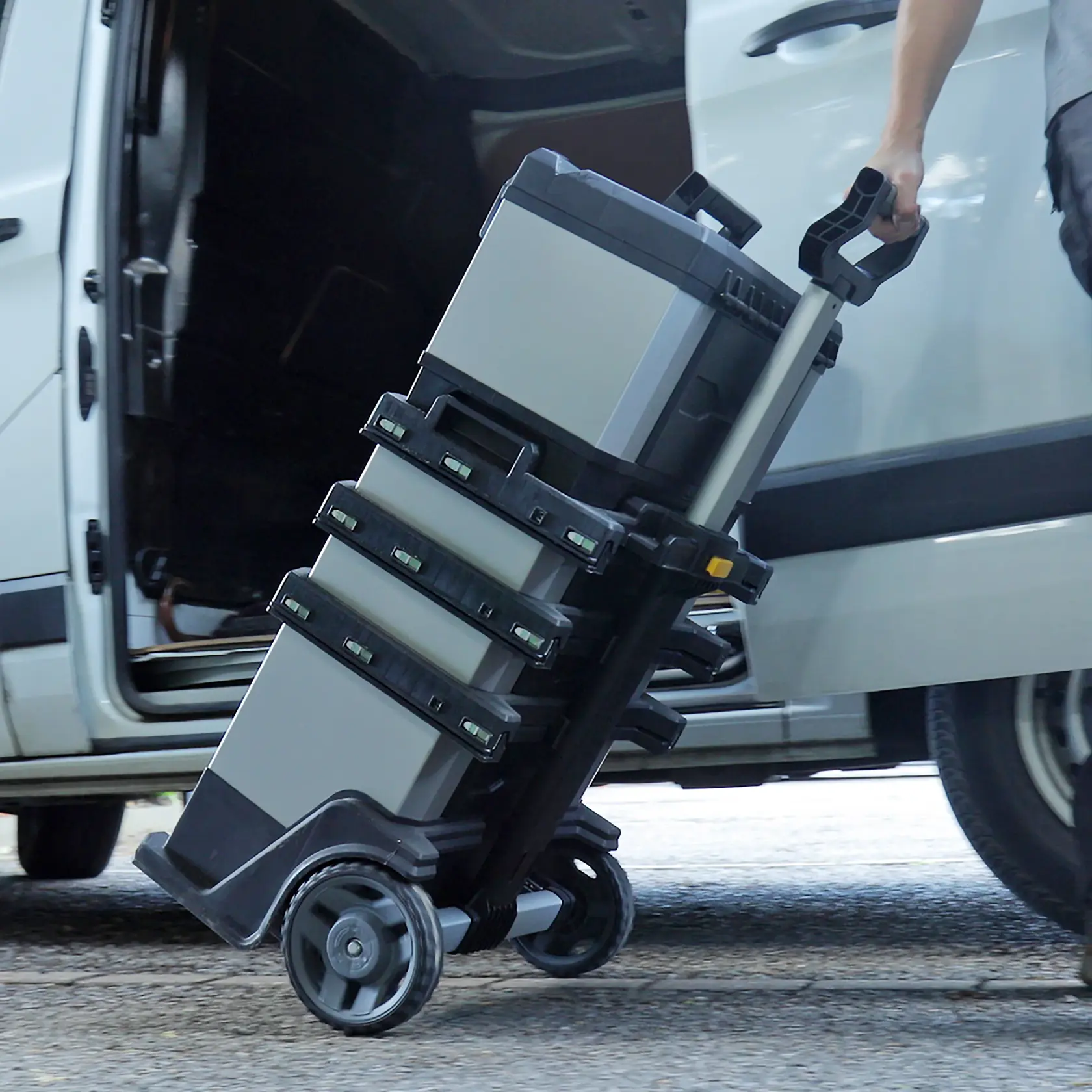 STANLEY 1-95-622 rolling tool chest with multiple compartments being transported from a vehicle.