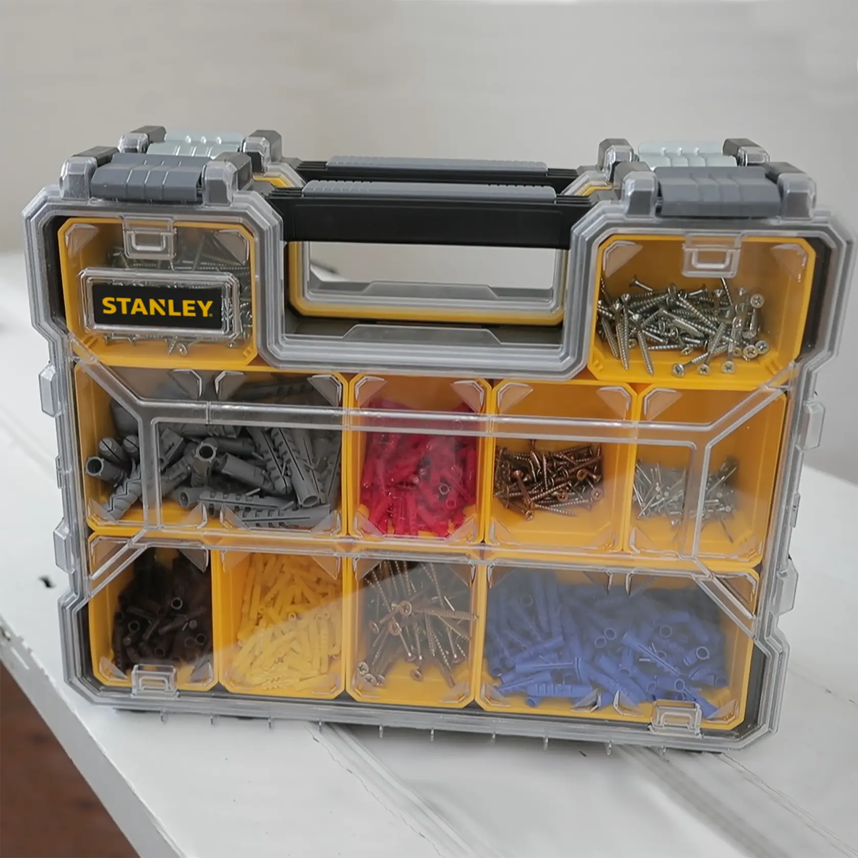 STANLEY 1-97-521 organizer box with assorted screws and wall plugs, product photo taken from front angle.