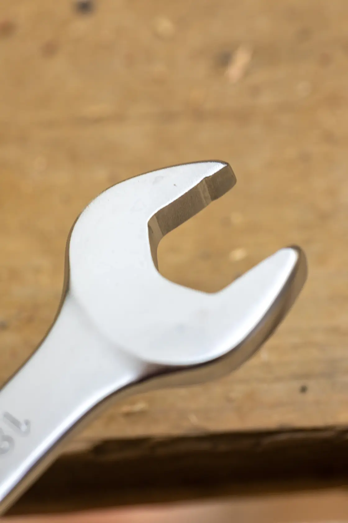 STANLEY FMMT13032-0 open-end wrench, photography, close-up angle on wooden surface.