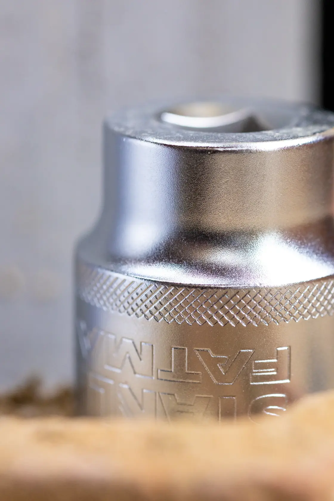 Photo of STANLEY FMMT17232-0 chrome socket with knurled grip, close-up angle, photography category.