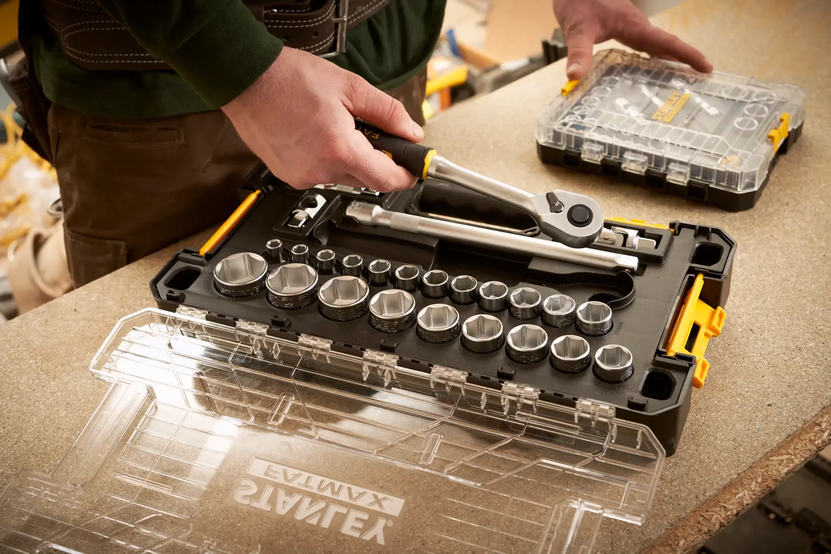 STANLEY FMMT98103-1 socket and ratchet set in black case with clear lid, close-up on workbench.