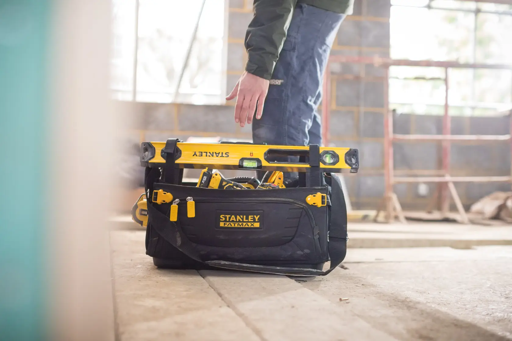 Photo of STANLEY FMST1-80146 tool bag with tools in a construction site.