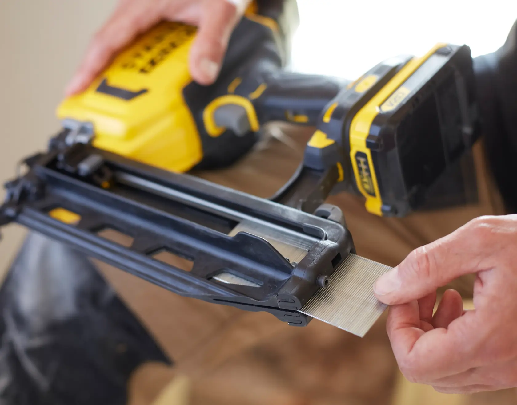STANLEY SFMCN616D2K cordless nailer, close-up angle, showing nails being loaded into the tool.