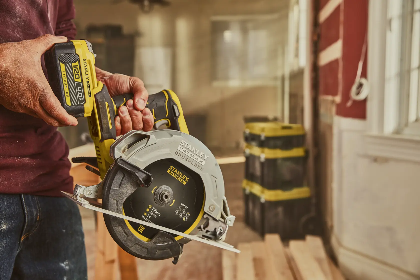Stanley SFMCS550M2K brushless cordless circular saw held in hand, construction setting.
