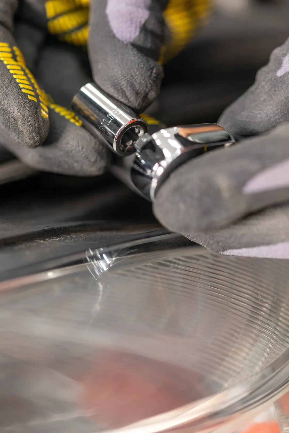 STANLEY STMT82663-0 socket being attached to a ratchet by gloved hands, close-up photography.