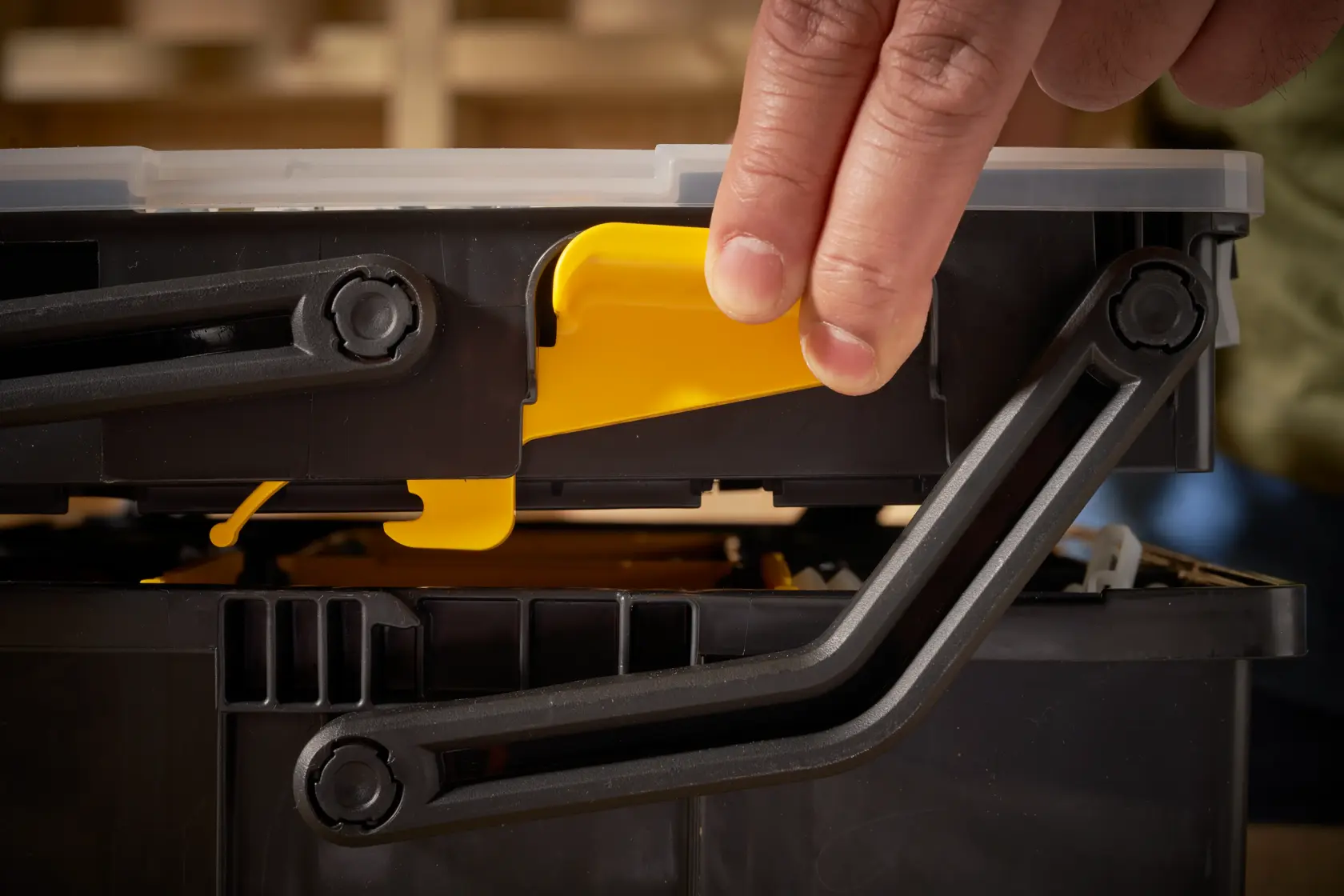 STANLEY STST1-75540 toolbox photography, close-up of yellow latch and black handles.