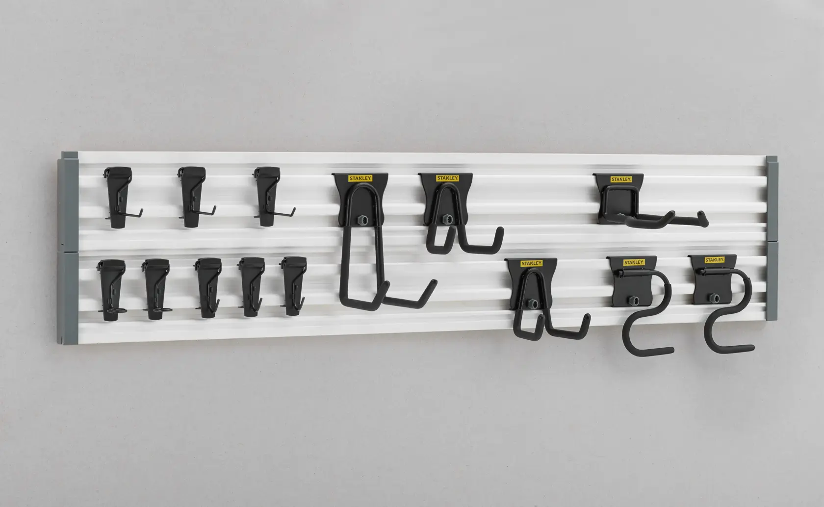 STANLEY STST22000-1 wall-mounted tool organizer with multiple black hooks, front angle.